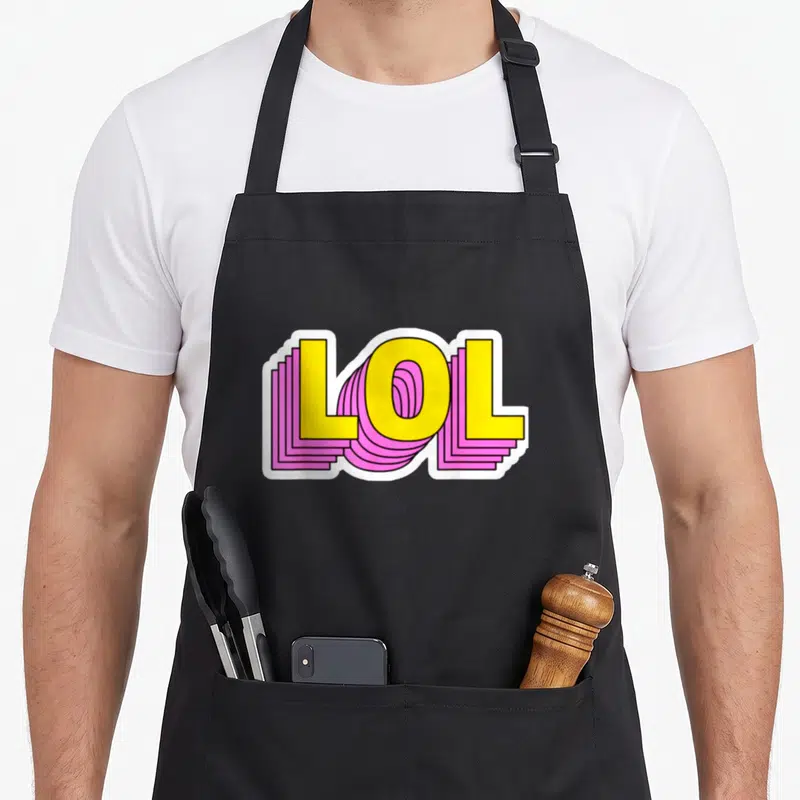 Tablier de cuisine noir avec l'inscription LOL en lettres jaunes et effets roses ondulés style pop art.