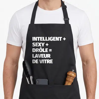 Tablier de cuisine noir avec inscription blanche formulant une équation humoristique sur le métier de laveur de vitre.