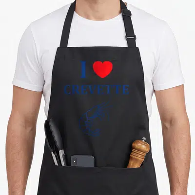 Tablier de cuisine noir avec le texte I love crevette, un cœur rouge et un dessin de crustacé en bleu.