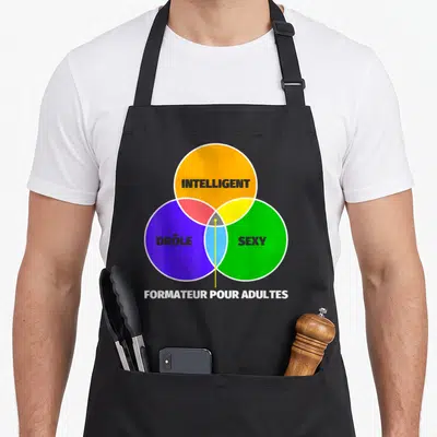 Tablier de cuisine noir avec un diagramme de Venn coloré et le texte formateur pour adultes en bas.