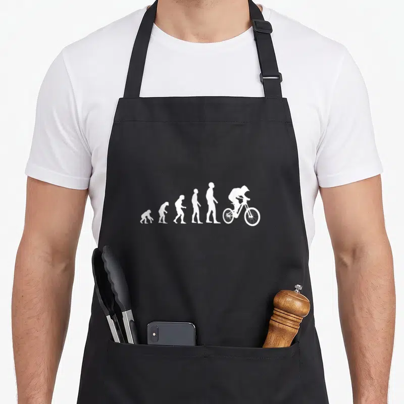Tablier de cuisine noir avec silhouette blanche évolution humaine vers cycliste VTT
