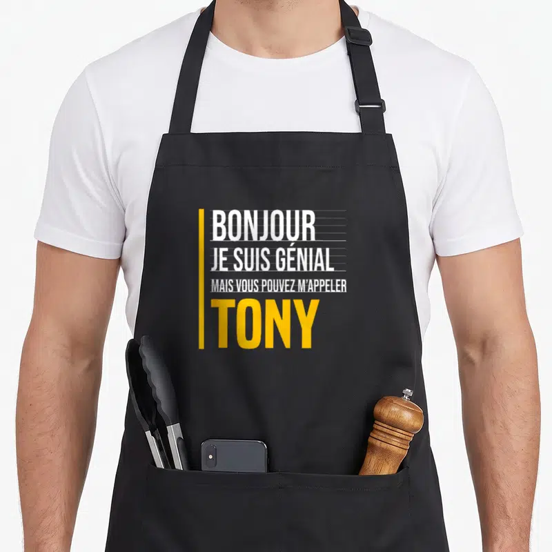 Tablier de cuisine noir avec texte blanc et jaune disant bonjour je suis génial mais vous pouvez m'appeler Tony.