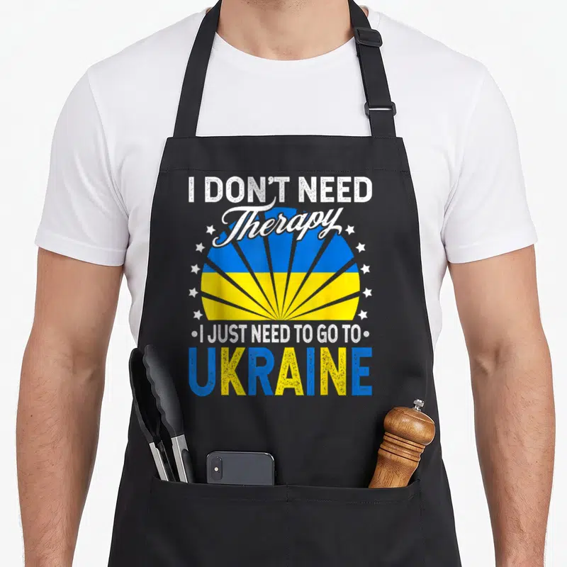 Tablier de cuisine noir avec inscription I Don't Need Therapy et soleil aux couleurs du drapeau ukrainien.