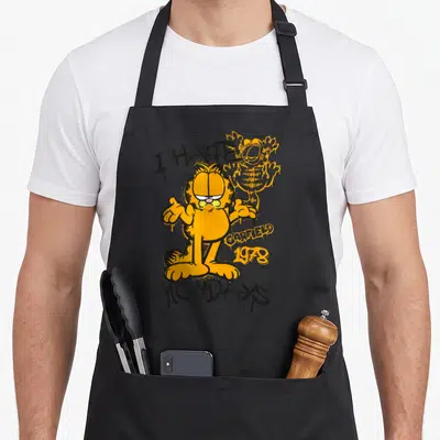 Tablier de cuisine noir avec Garfield orange en pose de graffiti et texte I HATE MONDAYS.