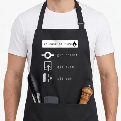 Tablier de cuisine noir avec pictogrammes blancs git commit, git push et git out sous la mention in case of fire.