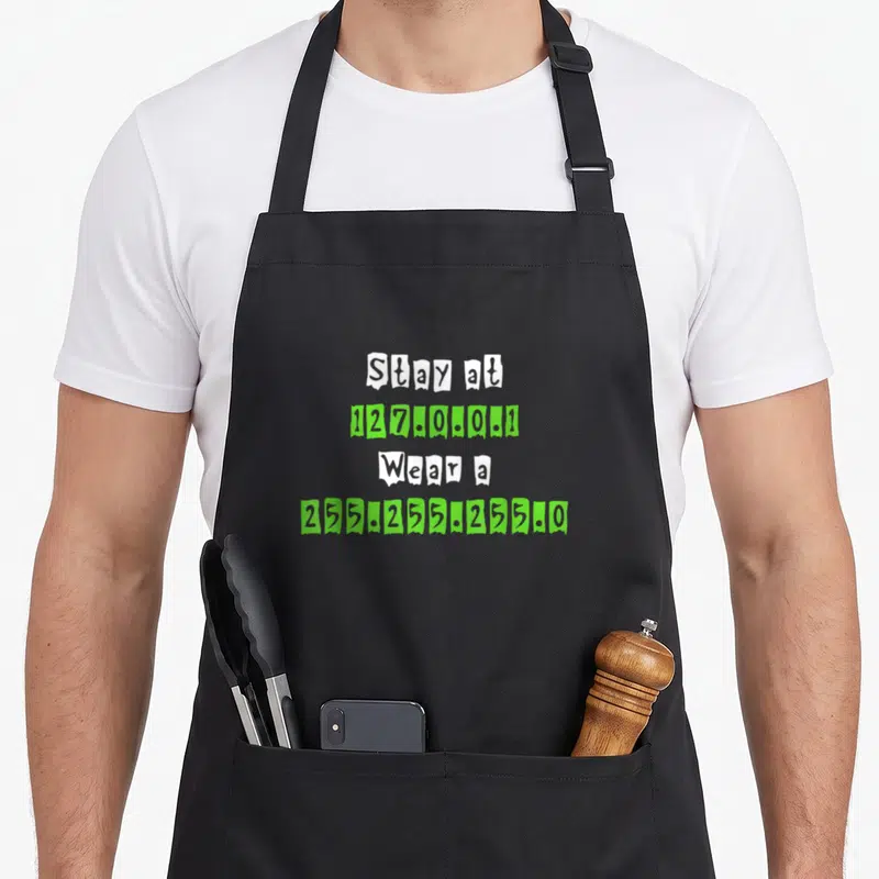 Tablier de cuisine noir avec le texte Stay at 127.0.0.1 Portez un 255.255.255.0 en blanc et vert lime.
