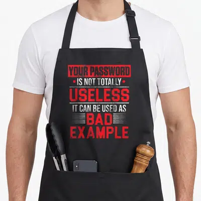 Tablier de cuisine noir avec inscription rouge et blanche sur la sécurité des mots de passe informatiques.