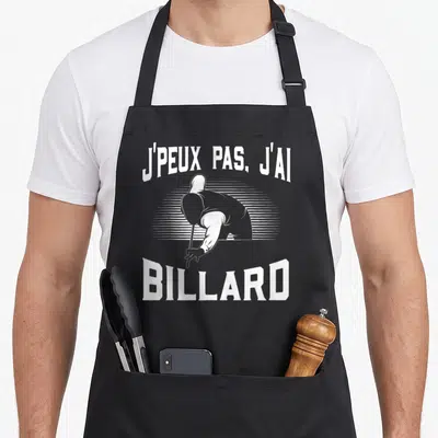 Tablier de cuisine noir avec illustration d'un joueur de billard et le texte j'peux pas j'ai billard en blanc.