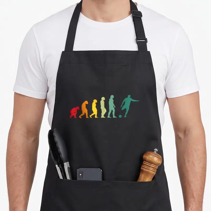 Tablier de cuisine noir avec silhouette évoluant en joueur de foot colorée