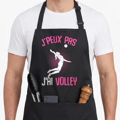 Tablier de cuisine noir avec silhouette blanche et texte rose j'peux pas j'ai volley
