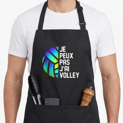 Tablier de cuisine noir avec un ballon aux couleurs dégradées et le texte je peux pas j'ai volley.