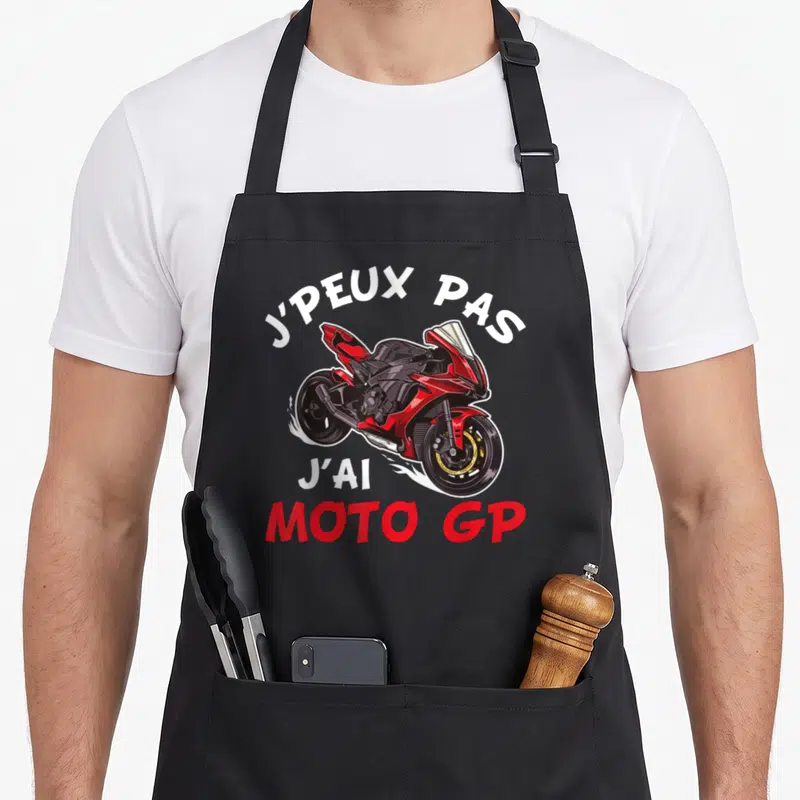 Tablier de cuisine noir avec une illustration de moto GP rouge et la citation J'peux pas j'ai Moto GP