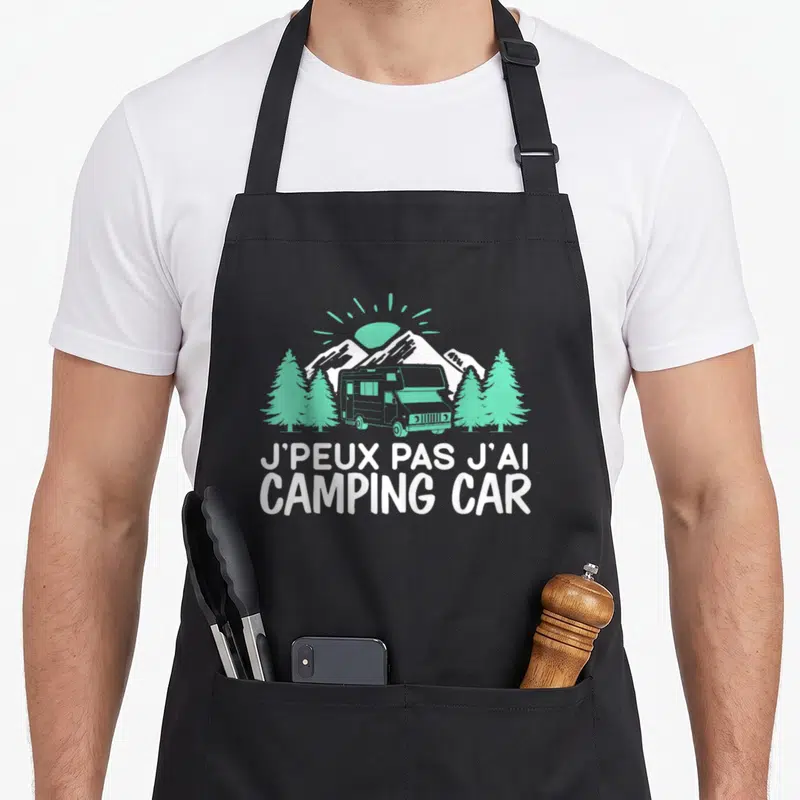 Tablier de cuisine noir avec illustration d'un camping car vert et texte blanc J'peux pas j'ai camping car campeur