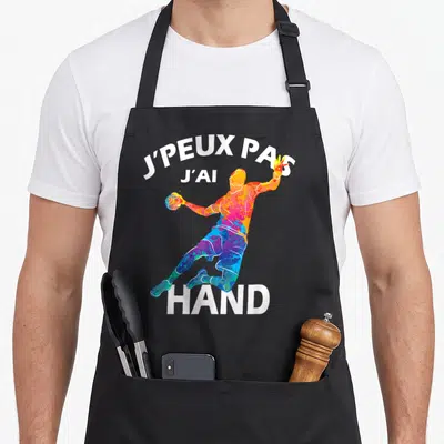 Tablier de cuisine noir avec illustration colorée d'un handballeur et texte blanc J'PEUX PAS J'AI HAND