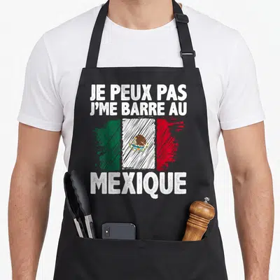 Tablier de cuisine noir avec inscription blanche et drapeau du Mexique stylisé au centre.