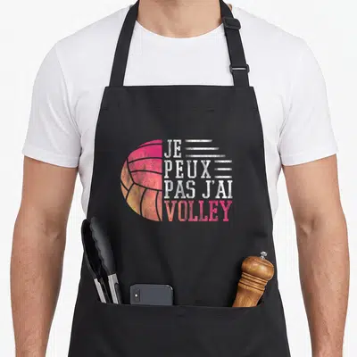 Tablier de cuisine noir avec un ballon de volley rose orange et le texte je peux pas j'ai volley en blanc.