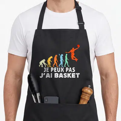 Tablier de cuisine noir avec silhouette évolutive colorée et texte blanc je peux pas j'ai basket