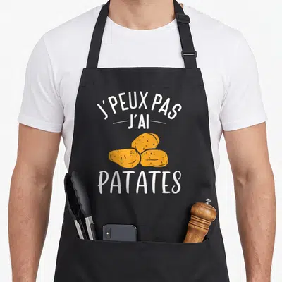 Tablier de cuisine noir avec illustration de trois patates oranges et texte blanc J'peux pas j'ai patates