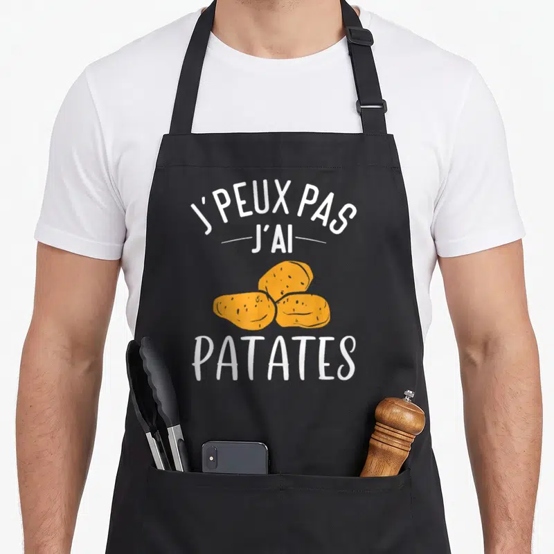 Tablier de cuisine noir avec illustration de trois patates oranges et texte blanc J'peux pas j'ai patates