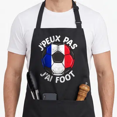 Tablier de cuisine noir avec un ballon de football tricolore et le texte jpeux pas jai foot en blanc.