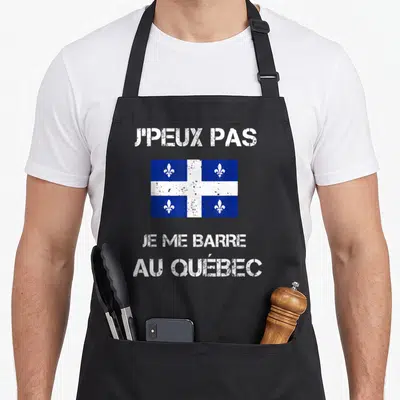 Tablier de cuisine noir avec le drapeau du Québec et le texte blanc JPEUX PAS JE ME BARRE AU QUÉBEC.