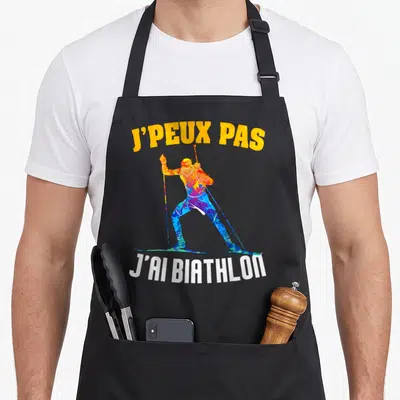 Tablier de cuisine noir avec silhouette multicolore d'un biathlète et le texte j'ai biathlon en bas.