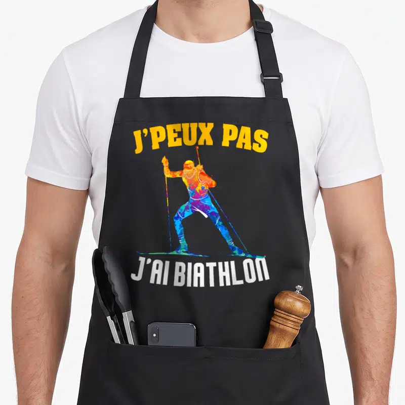 Tablier de cuisine noir avec silhouette multicolore d'un biathlète et le texte j'ai biathlon en bas.