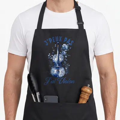 Tablier de cuisine noir avec illustration d'un violon bleu porcelaine entouré de fleurs et du texte j'ai violon.