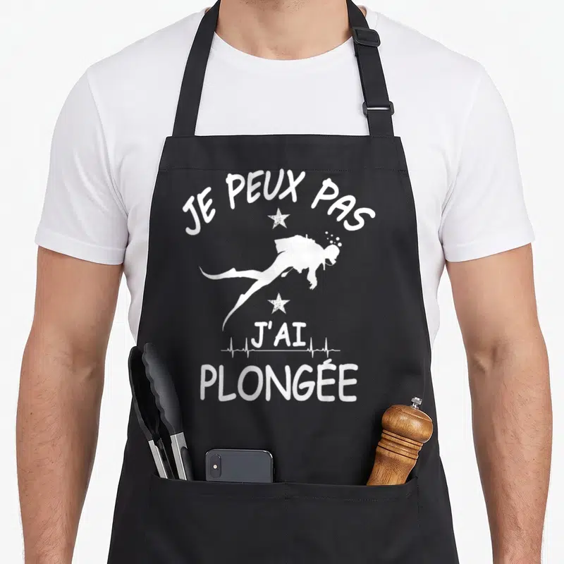 Tablier de cuisine noir avec silhouette de plongeur et texte Je peux pas j'ai plongée en blanc.