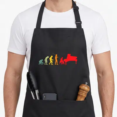 Tablier de cuisine noir avec silhouette évolutive colorée aboutissant à un pianiste rouge devant un piano.