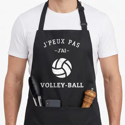 Tablier de cuisine noir avec illustration de balle de volley et texte blanc J'peux pas j'ai volley-ball
