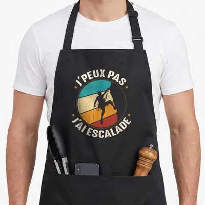Tablier de cuisine noir avec motif circulaire escalade et texte blanc j'peux pas j'ai escalade