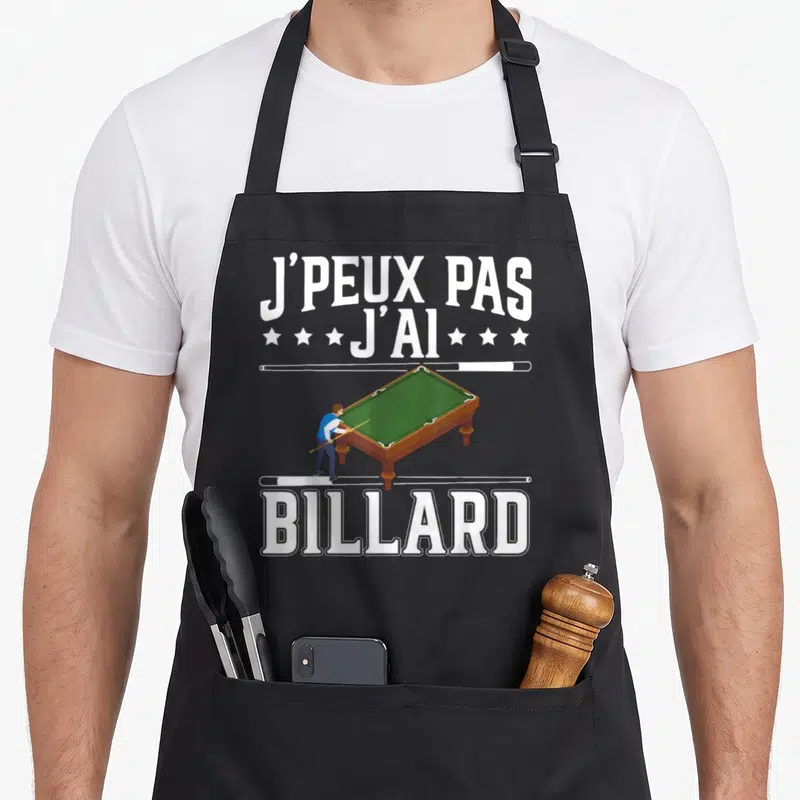 Tablier de cuisine noir avec texte blanc j'peux pas j'ai billard et illustration de table de billard verte avec joueur.