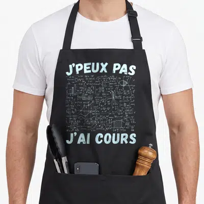 Tablier de cuisine noir avec l'inscription j'peux pas j'ai cours sur fond de formules mathématiques blanches.