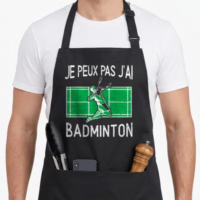 Tablier de cuisine noir avec silhouette de joueur de badminton vert et texte blanc Je peux pas j'ai badminton.