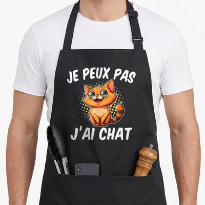 Tablier de cuisine noir avec illustration d'un chaton orange souriant et texte blanc Je peux pas j'ai chat.
