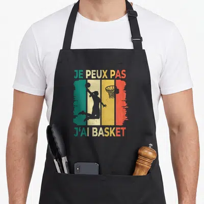 Tablier de cuisine noir avec silhouette basketteuse et texte je peux pas j'ai basket sur bandes vert jaune orange