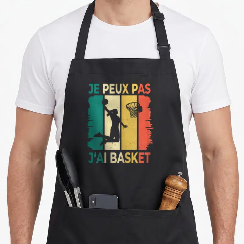Tablier de cuisine noir avec silhouette basketteuse et texte je peux pas j'ai basket sur bandes vert jaune orange