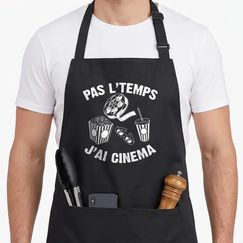 Tablier de cuisine noir avec inscription pas l temps j ai cinema et illustrations blanches de films et pop corn