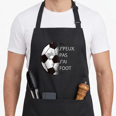 Tablier de cuisine noir avec illustration de ballon de football et texte blanc J'PEUX PAS J'AI FOOT