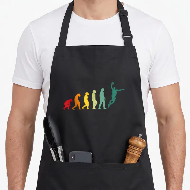 Tablier de cuisine noir avec silhouette évolutive colorée se transformant en joueur de basketball vert