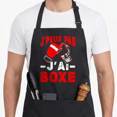 Tablier de cuisine noir avec gants de boxe rouges et texte j'peux pas j'ai boxe