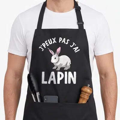 Tablier de cuisine noir avec illustration d'un lapin gris et texte blanc J'peux pas j'ai lapin