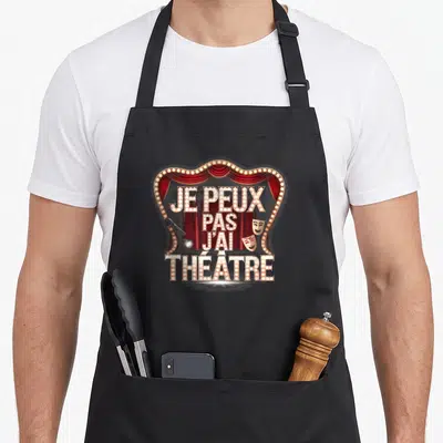 Tablier de cuisine noir avec motif scène de théâtre illuminée et texte je peux pas j'ai théâtre.