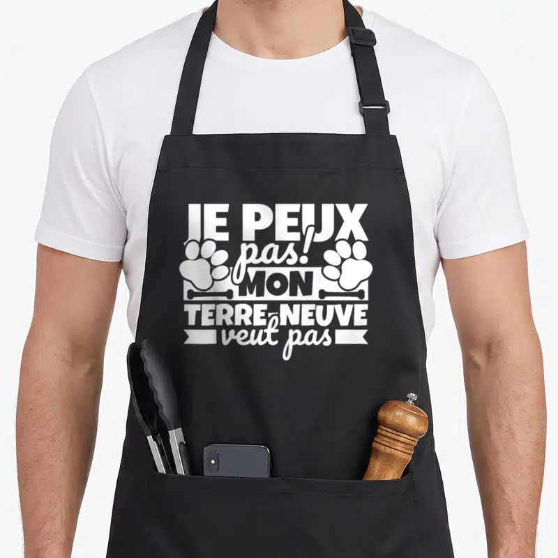 Tablier de cuisine noir avec inscription blanche Je peux pas mon Terre-Neuve veut pas et des traces de pattes.