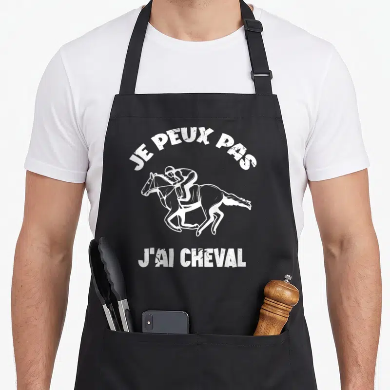 Tablier de cuisine noir avec illustration blanche d'un jockey et le texte je peux pas j'ai cheval.