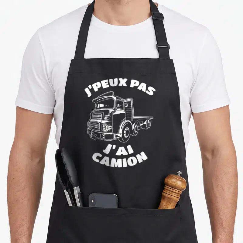 Tablier de cuisine noir avec illustration de camion poids lourd et texte blanc J'peux pas j'ai camion