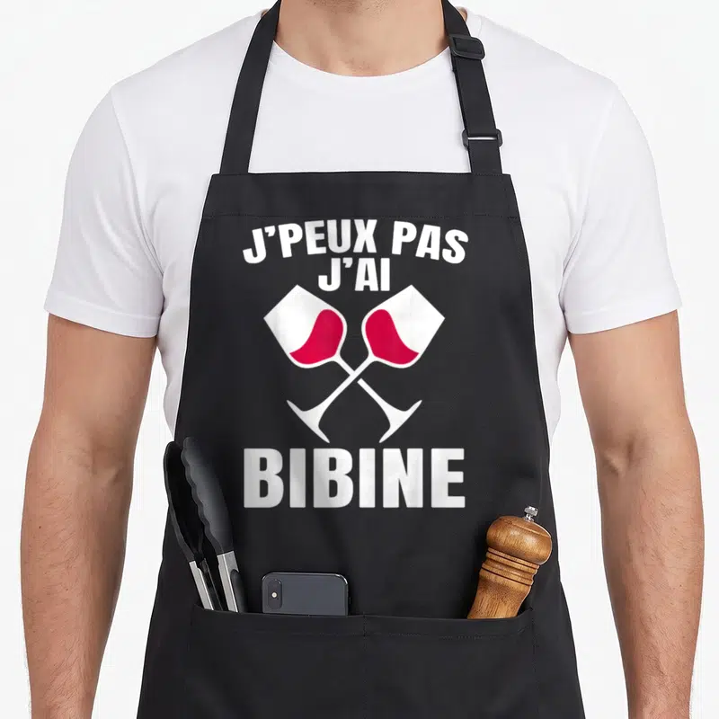 Tablier de cuisine noir avec l'inscription j'peux pas j'ai bibine et deux verres de vin rouge croisés en blanc et rose.