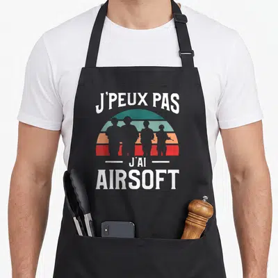 Tablier de cuisine noir avec motif vintage J'peux pas j'ai Airsoft et silhouettes de joueurs.