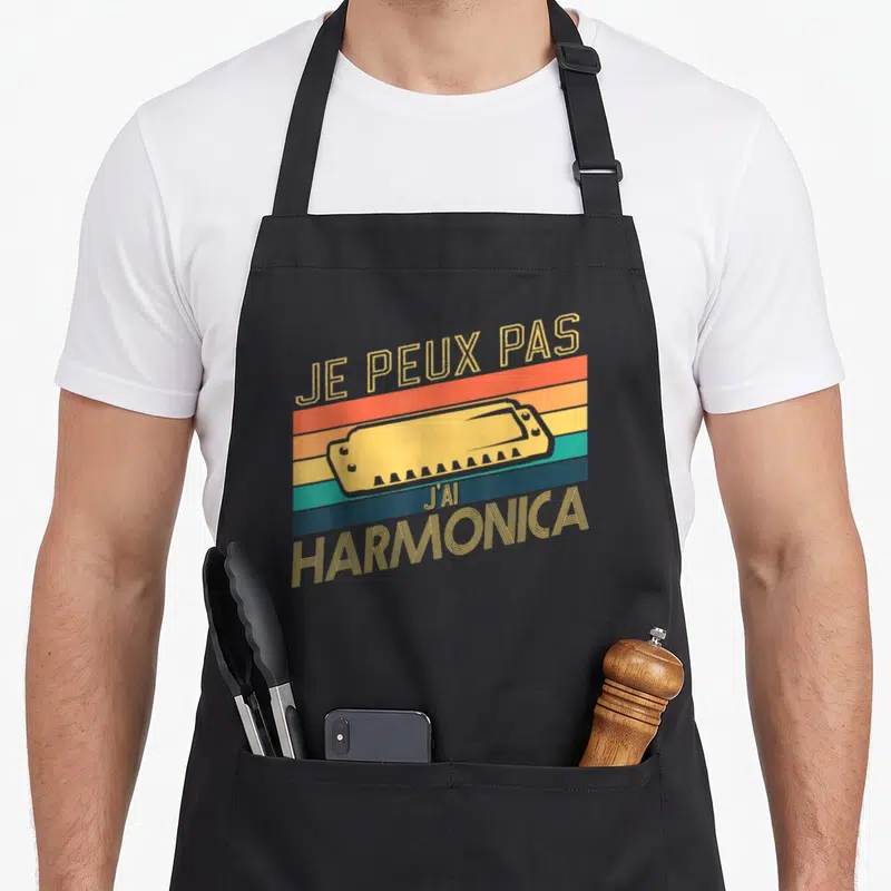 Tablier de cuisine noir avec illustration d'une harmonica jaune sur fond de bandes colorées vintage